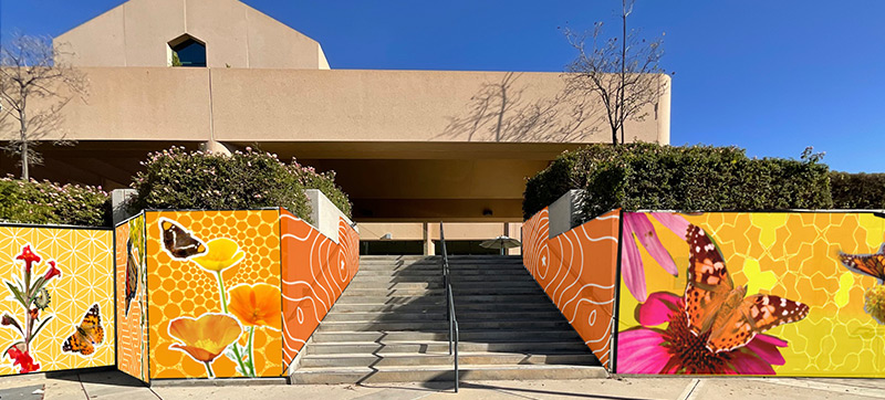 Front facade of the Humanities Building with digital concept of mural