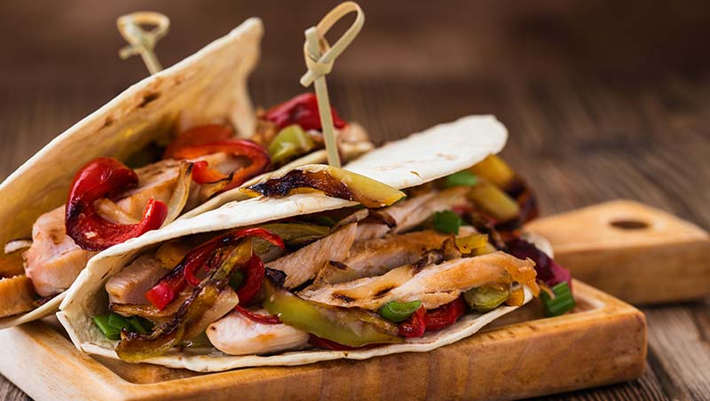 Two tacos with fajitas and grilled bell peppers