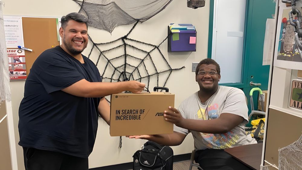 Student Darrin Pleasure received a Chromebook prize at the event.