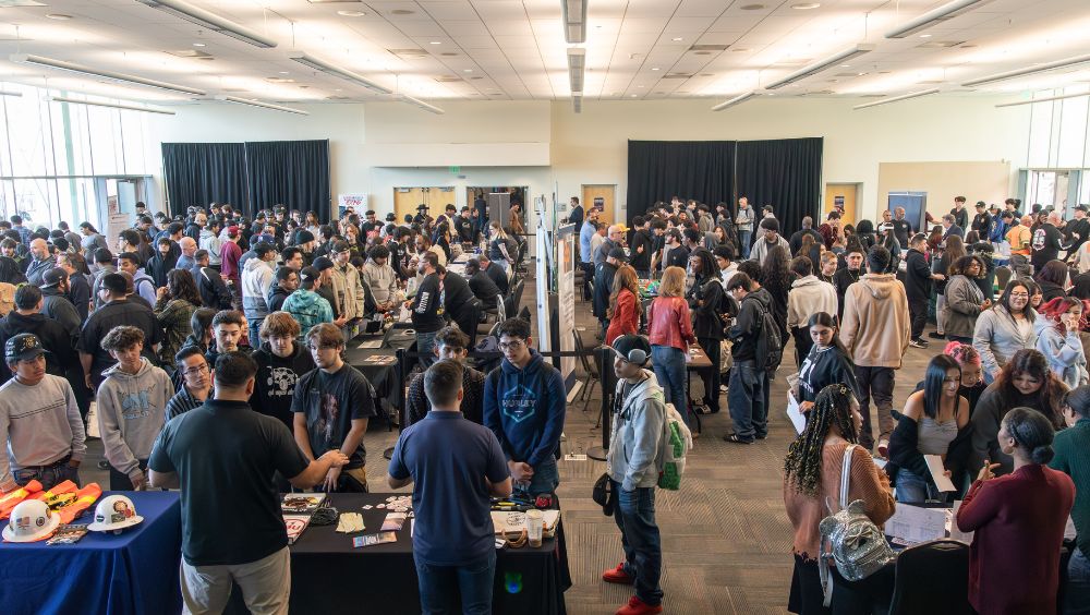 Zoomed out view of expo attendees in main hall