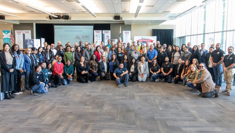 Group shot of expo leadership, with at least 50 people present