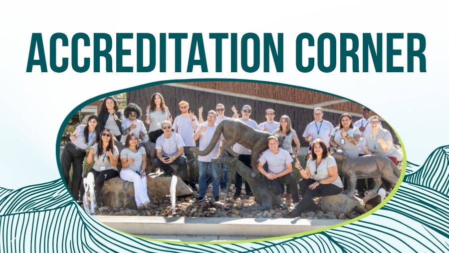 Photo of accreditation kickoff attendees in front of Welcome Center building