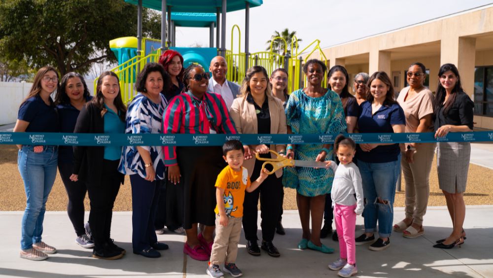 A group of MVC employees cut the ECEC playground ribbon