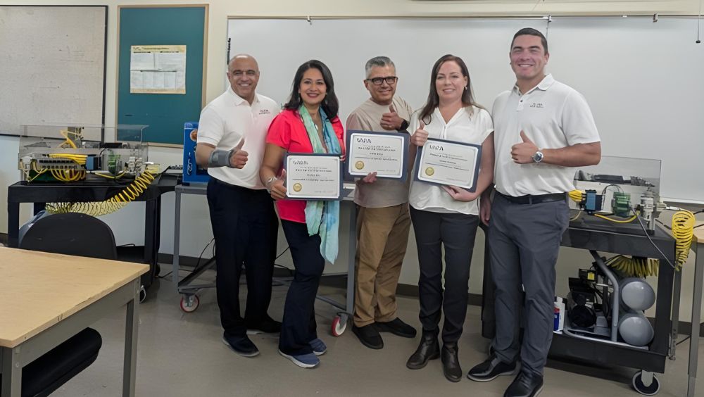 MVC educators hold up their SACA certifications