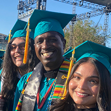 Michael Dwayne Davis, Jr. (center) surrounded by classmates at the 2026 Commencement Ceremony